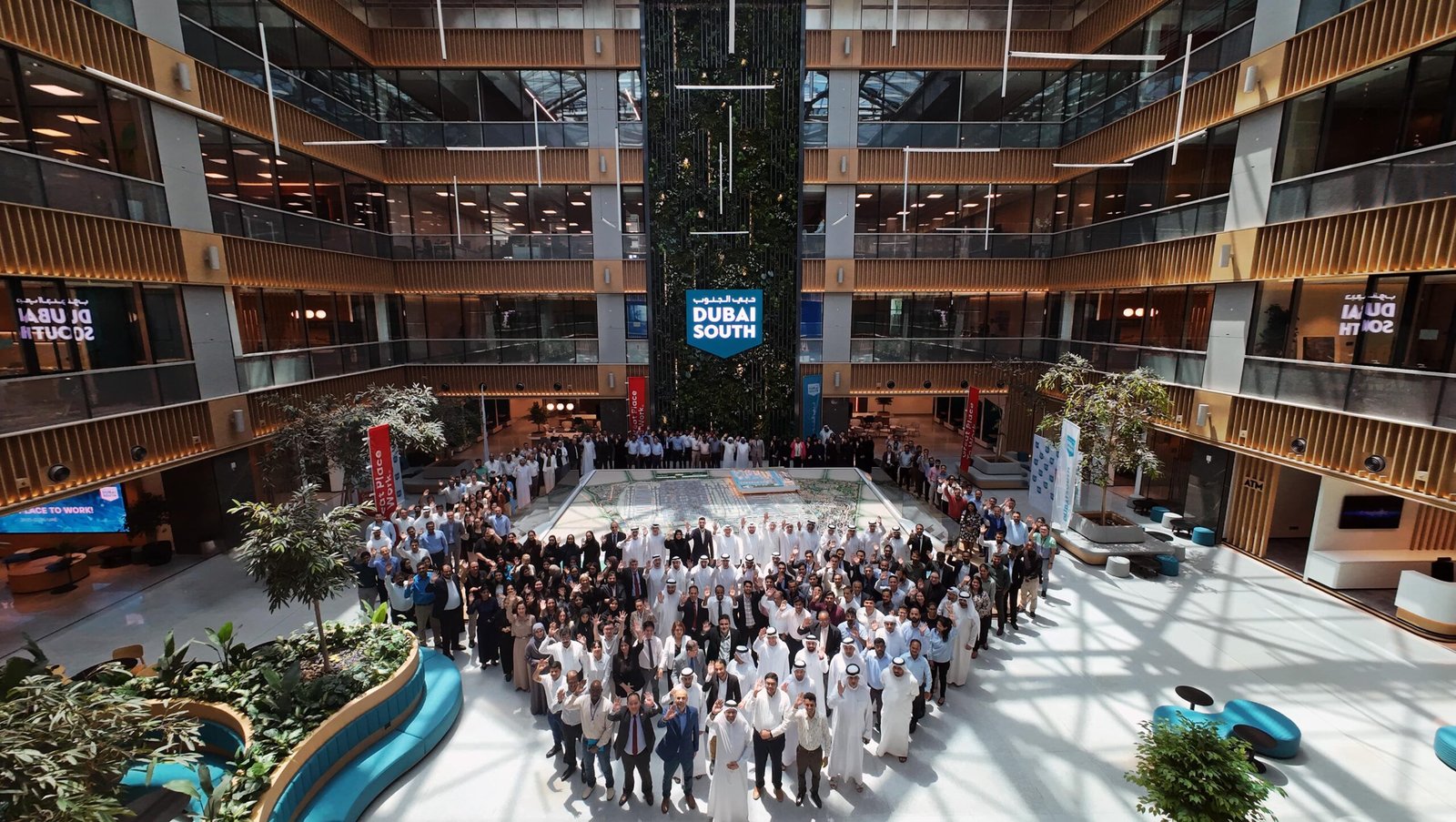 Large crowd gathered in a multi-storey atrium hall