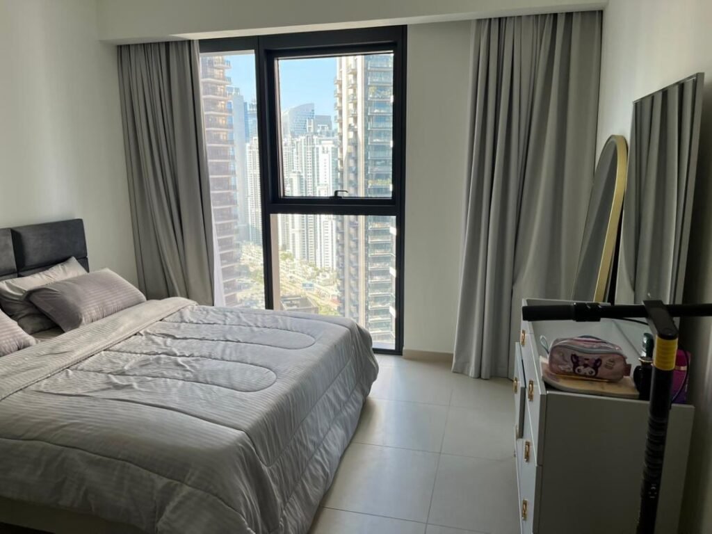 BLVD Central — 1 Bed — bedroom with floor-to-ceiling window